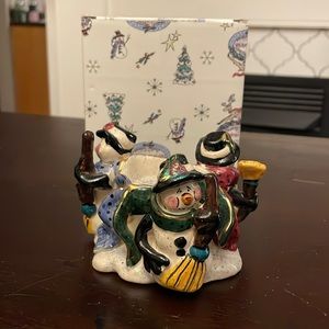 Snowman teacup candle holder.